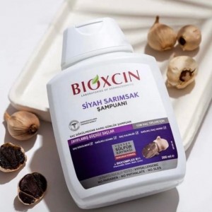 Bioxcin шампоан против косопад с черен чесън 300мл